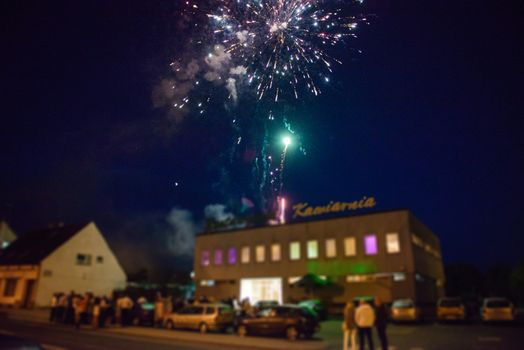 Wedding couple and fireworks, Bride, groom and wedding guests watching fireworks display