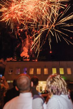 Wedding couple and fireworks, Bride, groom and wedding guests watching fireworks display