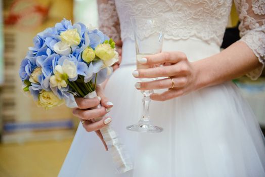 first toast of the bride and groom with a glass of champagne