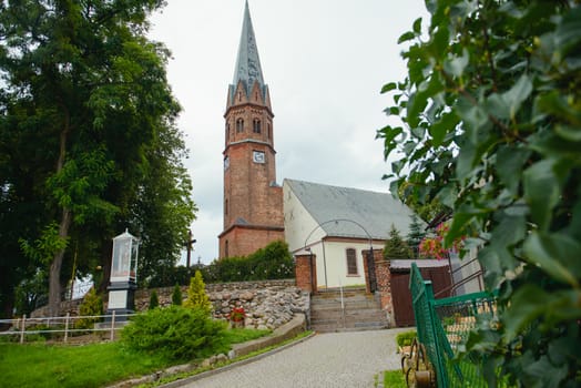 Church exterior during wedding ceremony. Blue sky with sunny weather