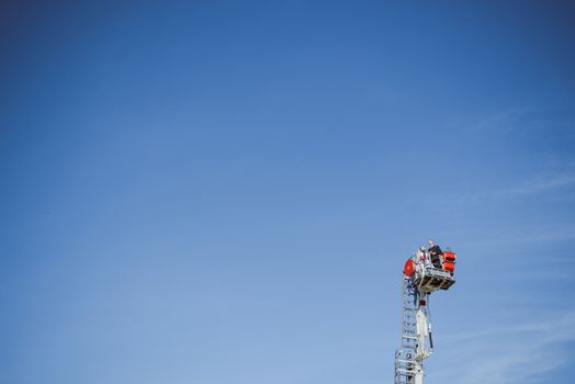 Beautiful wedding couple on outdoor photoshoot with fire truck