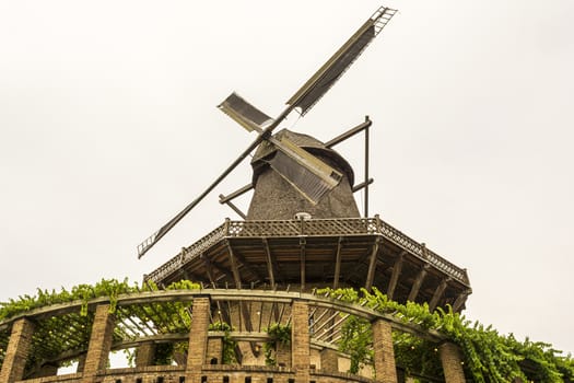 Historic Wind mill in Sanssouci Park in Potsdam, Germany. Sanssouci was a summer palace of King of Prussia Frederick the Great.