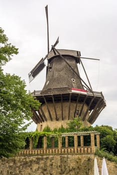 Historic Wind mill in Sanssouci Park in Potsdam, Germany. Sanssouci was a summer palace of King of Prussia Frederick the Great.