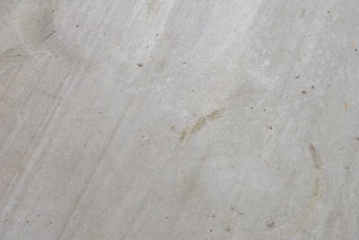 Close up of cracked concrete floor texture.