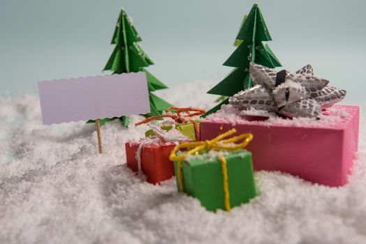 christmas presents nicely decorated with bows and feathers. view from above