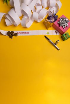 Long twisted expanded empty letter. Copy space. yellow background. View from above