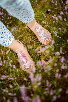 a photo of woman in the forest where the purple heather blooms. copy space