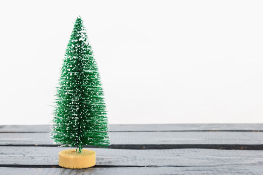 Christmas composition decorations, minimal green fir tree branches with snow on white background. Merry Christmas concept. Copy space for text