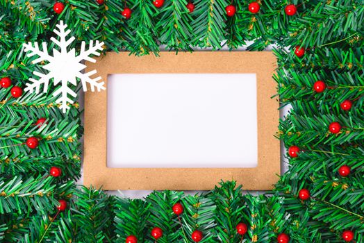 Happy New Year and Christmas day, top view flat lay composition decoration branches tree photo frame on white background with copy space for your text