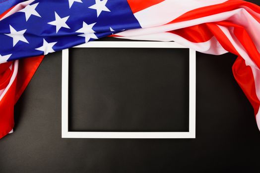 Martin luther king day, flat lay top view, American flag and photo frame on black background with copy space for your text