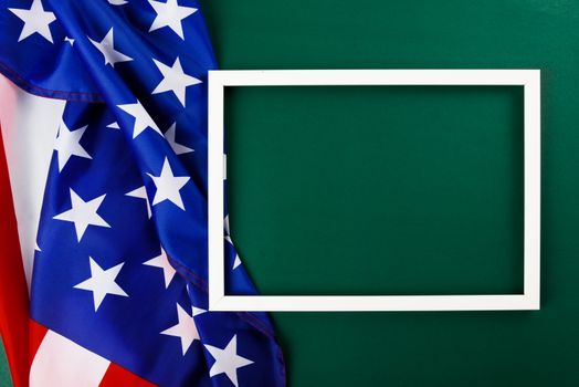 President's Day Concept, flat lay top view, America Flag and photo frame on Olive green background with copy space for your text