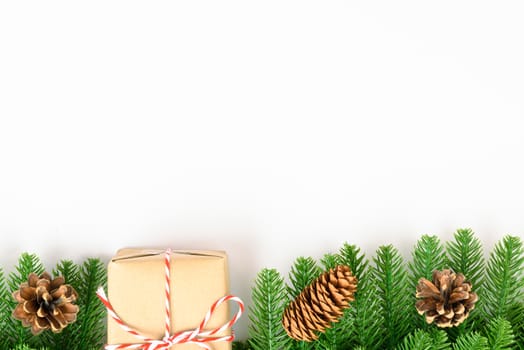 Happy new year or christmas day top view decorative fir tree and gift box on white background with copy space for your text