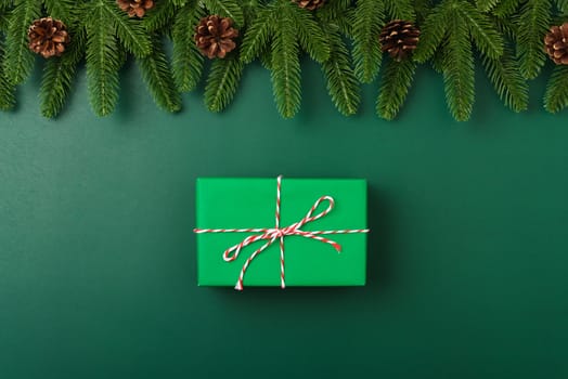 Happy new year, christmas day concept top view flat lay fir tree branches, gift box and decoration