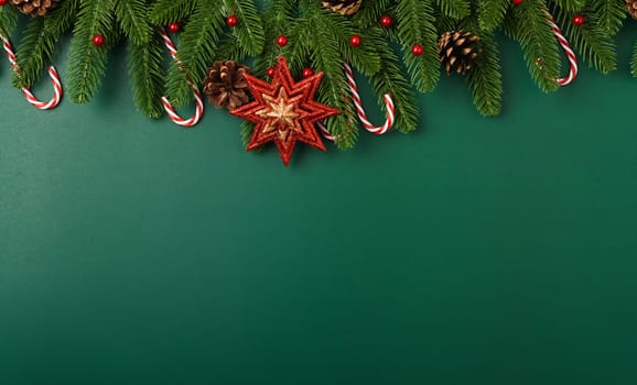 Happy new year, christmas day concept top view flat lay fir tree branches and decoration on Olive Green background with copy space for your text