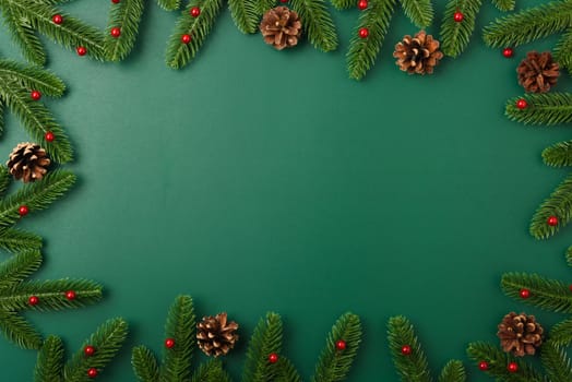 Happy new year, christmas day concept top view flat lay fir tree branches and decoration on Olive Green background with copy space for your text