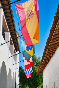 Five International Flags  on White Plaster Building