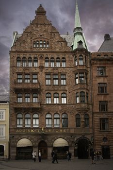 MALMO, SWEDEN - 13 September 2019: The city's oldest pharmacy Apoteket Lejonet on City Hall Square, well-known for its vintage Art Noveau interior at sunset