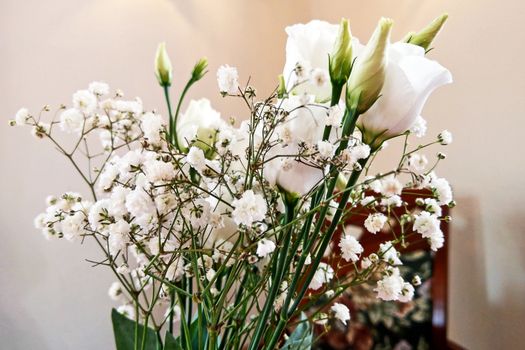 White roses flower arrangement in a glass vase