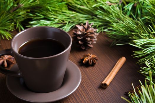 Christmas new year concept with coffee Cup, Christmas tree and cones. Layout with a Cup of coffee for new year and Christmas.