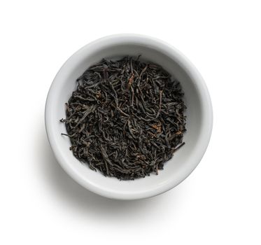 Black tea top view on white background.