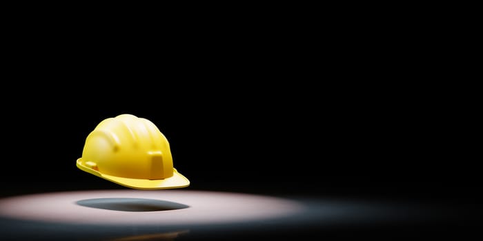 Yellow Hard Hat Spotlighted on Black Background with Copy Space 3D Illustration
