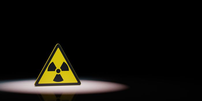 Ionizing Radiation Hazard Symbol Spotlighted on Black Background with Copy Space 3D Illustration