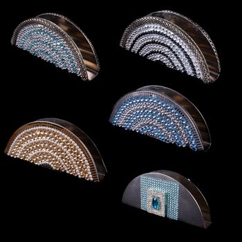 Luxurious Tissue holders in different designs, on black studio background.