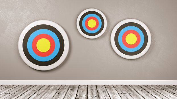 Three Different Size Colorful Arrow Targets Against a Gray Wall with Copy Space 3D Illustration