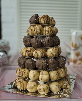 stack of whipped cream Puffs with chocolate and caramel