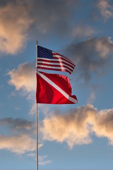 American and Diving Flag on Sunset Clouds
