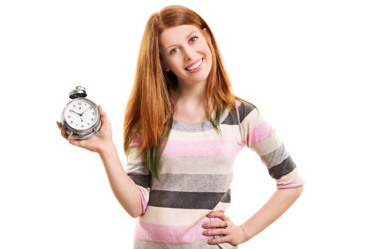 Time concept. Portrait a beautiful young girl holding an old fashioned alarm clock and smiling, isolated on white background.