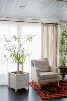 sofa near the window of a large light window, restaurant cozy interior texture of a wooden wall