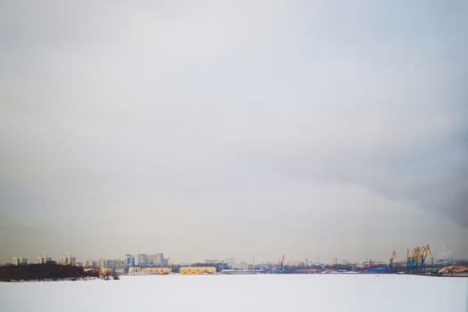 background winter view of the city from the river, background for text