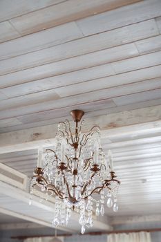 crystal glass vintage chandelier hanging on wooden light ceiling light