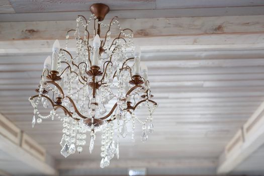 crystal glass vintage chandelier hanging on wooden light ceiling light