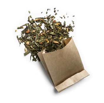 Green tea with aromatic additives. Top view on white background.