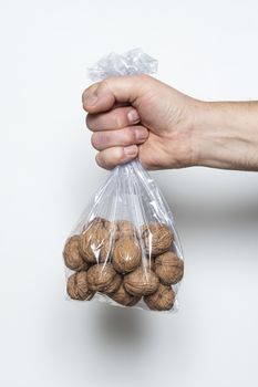 Some walnuts in a plastic bag