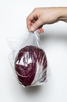 A red radicchio in a plastic bag