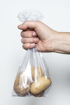 Some potatoes in a plastic bag