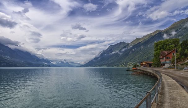 Lake and Alps mountains at Brienz by cloudy day in Switzerland