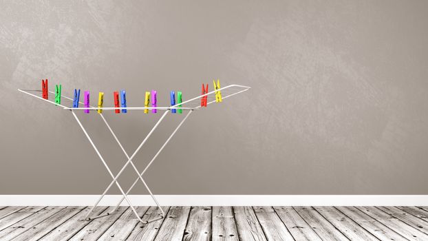 White Clothes Drying Rack with Colorful Clothespins on Wooden Floor Against Gray Wall with Copy Space 3D Illustration
