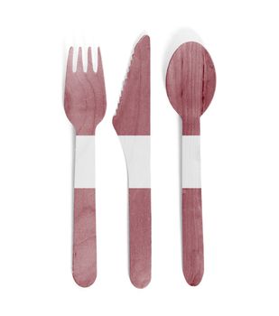 Eco friendly wooden cutlery - Plastic free concept - Isolated - Flag of Latvia