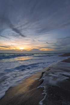 A color landscape image of sunrise at the Atlantic Ocean in Florida, USA.