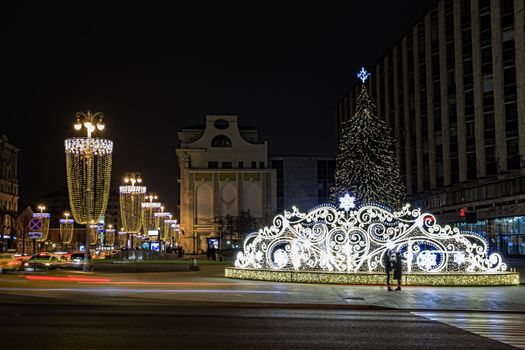 The city is decorated with festive illumination for the New Year. Excursions to New Year's Moscow. Celebrations in Moscow. Christmas lights on the buildings. The decorated capital. A trip to Russia. Christmas tree.