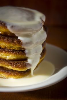 Fresh hot pancakes on a white ceramic plate