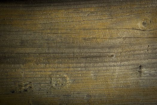 An old wood background showing scratches and cuts from wear and tear