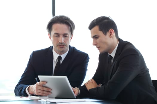 Business people using tablet pc together at office