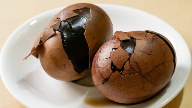 The close up of Taiwan Tea Eggs on mini white plate.