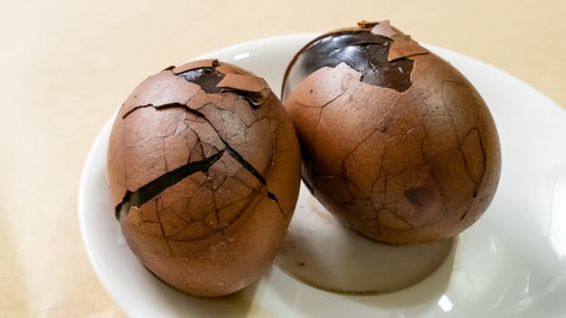 The close up of Taiwan Tea Eggs on mini white plate.