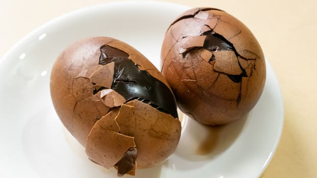 The close up of Taiwan Tea Eggs on mini white plate.